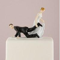 comical couple with the bride having the upper hand cake topper