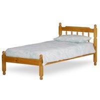 colonial wooden spindle bed in honey pine