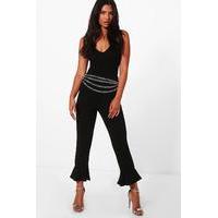 crepe ruffle hem skinny trousers black