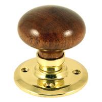 dark wood interior door knobs on brass fixing plate