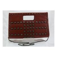 Dark russet coloured cut out handle bag