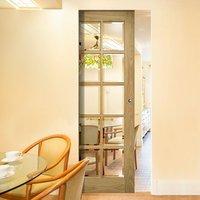 Deanta Bristol Oak Unfinished Syntesis Pocket Door with 10 Pane Clear Bevelled Glass
