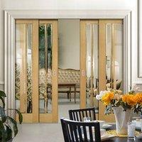 Deanta Quad Telescopic Pocket Norwich American Oak Veneer Doors - Clear Bevelled Safety Glass - Unfinished