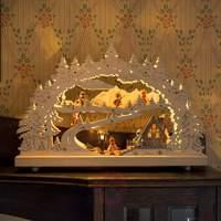 decorative led candle arch snow covered landscape
