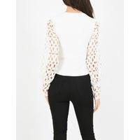 diane white top with low neckline laser cut sleeves