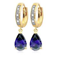 diamond and sapphire droplet huggie earrings in 9ct gold