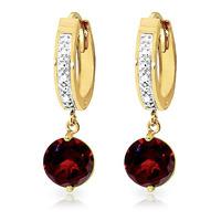 diamond and garnet huggie earrings in 9ct gold