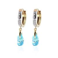 Diamond and Blue Topaz Droplet Huggie Earrings in 9ct Gold