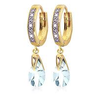 diamond and aquamarine droplet huggie earrings in 9ct gold