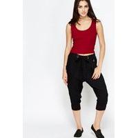 drop crotch black cropped trousers