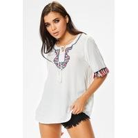 Emily White Floral Embroidery Tassel Detail Top
