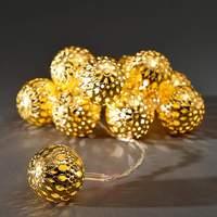 Golden LED string lights, large metal balls