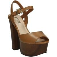 Guess Flde21 Lea03 Sandals women\'s Clogs (Shoes) in brown