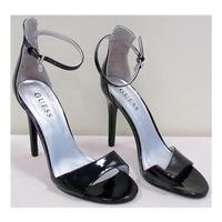 Guess size 7.5 black patent heels