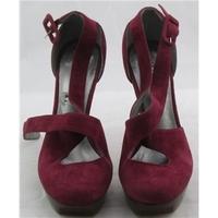 Guess, size 3 plum suede platform stilettos