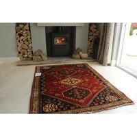 hand made red persian qashqai wool rug