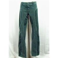 In Wear green trousers Size 16