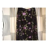 Karen Millen - Size: 12 - Black flower design- Pencil skirt