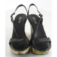 Kenneth Cole Reactions, size 4.5 black sandals with flower print wedged heels