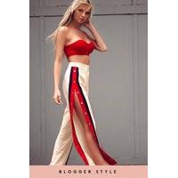 khloe beige side popper red stripe trousers