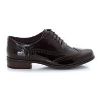 lace up patent leather brogues with low heel