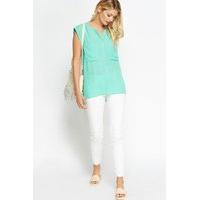 large pocket front green top