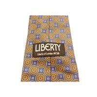 Liberty Silk Tie Blue With Terracotta Floral Circle Design