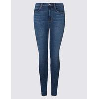 limited edition frayed hem mid rise skinny leg jeans