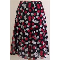 Marks & Spencer size 12 calf length black skirt with red and white spot design