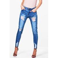 Mid Rise Destroyed Thigh And Ankle Skinny Jeans - mid blue