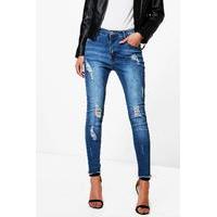 Mid Rise All Over Distress Skinny Jeans - mid blue