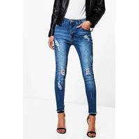 mid rise all over distress skinny jeans mid blue