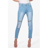 mid rise embroidered distressed knee skinny jeans blue