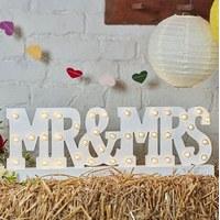 mr mrs wedding table sign with wooden illuminated letters in white