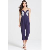 navy plunge neck jumpsuit with lace motif