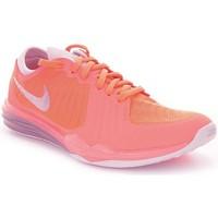 Nike Dual Fusion TR 4 women\'s Shoes (Trainers) in Orange