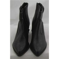 NWOT Limited Edition, size 5.5 black ankle boots