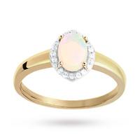 oval cut opal and diamond set ring in 9 carat yellow gold ring size o