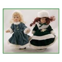 Pair of dolls on stands