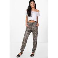 paisley print trousers tan