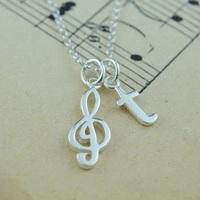 personalised silver treble clef necklace