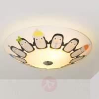 Penguin-motif ceiling light Tipsy with LED lamps