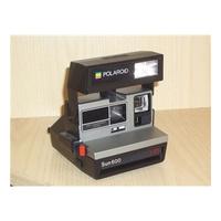 Polaroid Sun 600 LMS instant film camera.