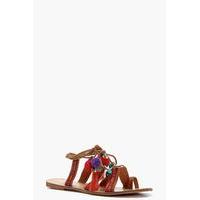 pom pom ghillie lace up sandals tan