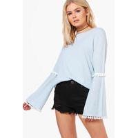 pom trim flare sleeve top blue