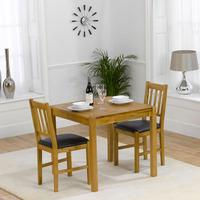 promo solid oak dining table and 2 promo chairs