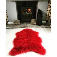 red soft shaggy faux sheepskin rug