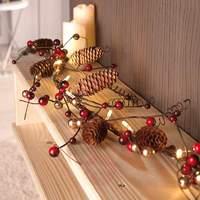 Red and brown LED string lights with fir cones