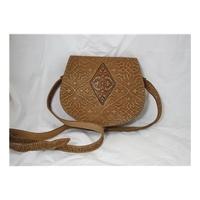 retro 70s style light tan handbag