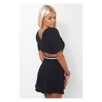 riptide black cross back playsuit